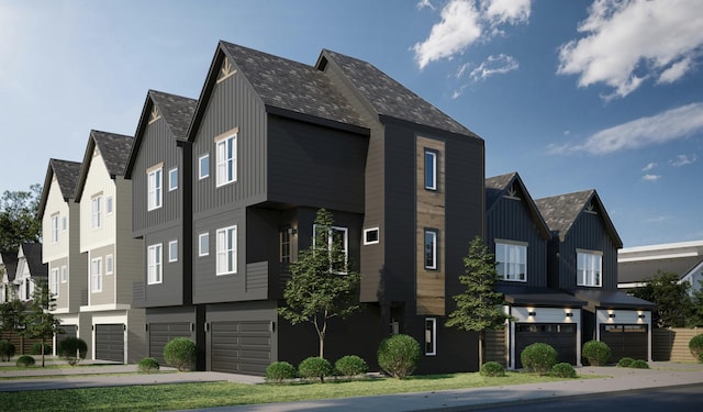 exterior space featuring a garage, board and batten siding, and a residential view