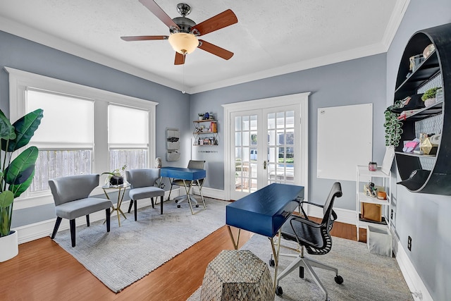 office area featuring baseboards, french doors, wood finished floors, and crown molding