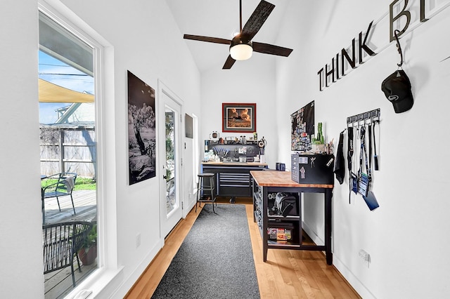 interior space featuring light wood-type flooring and baseboards