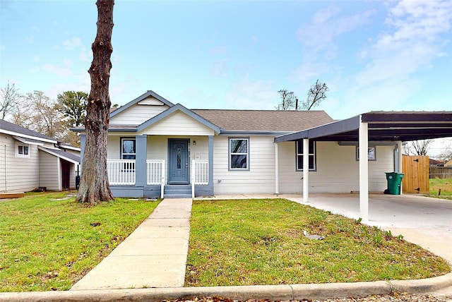 view of front of home featuring a carport, a porch, a front lawn, and a shingled roof