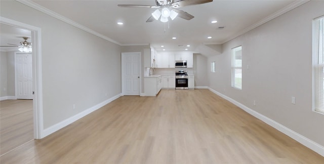 unfurnished living room featuring recessed lighting, baseboards, light wood-style floors, and crown molding