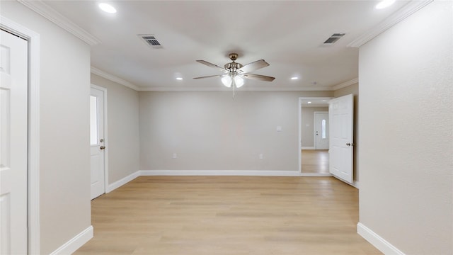 unfurnished room with visible vents, baseboards, light wood-type flooring, ornamental molding, and recessed lighting