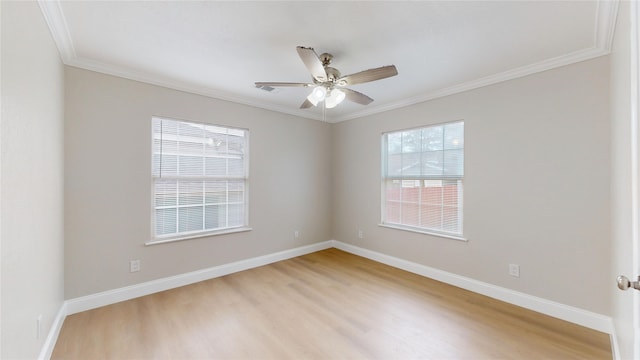 unfurnished room with ceiling fan, light wood-style floors, baseboards, and ornamental molding