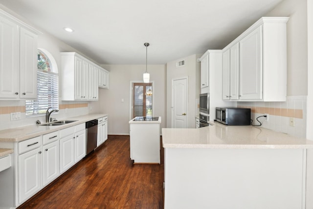 6923 Queensclub Dr, Houston, TX 77069 - kitchen with a sink, appliances with stainless steel finishes, white cabinets, backsplash, and recessed lighting