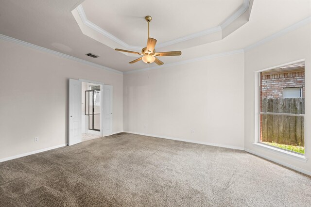 6923 Queensclub Dr, Houston, TX 77069 - carpeted empty room featuring a tray ceiling, ornamental molding, and ceiling fan