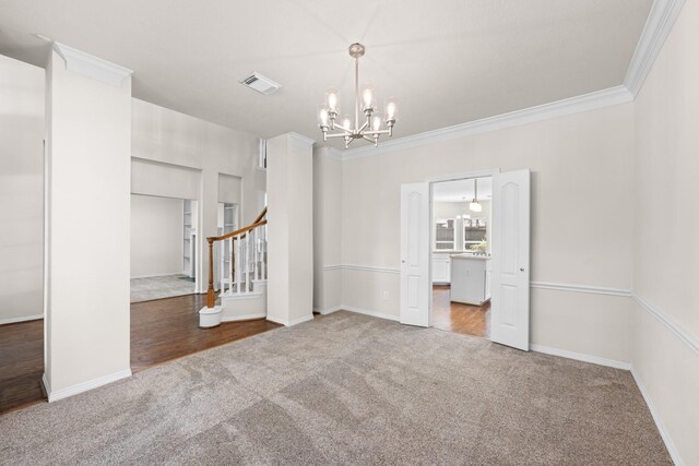 6923 Queensclub Dr, Houston, TX 77069 - carpeted spare room featuring a chandelier, stairs, and crown molding