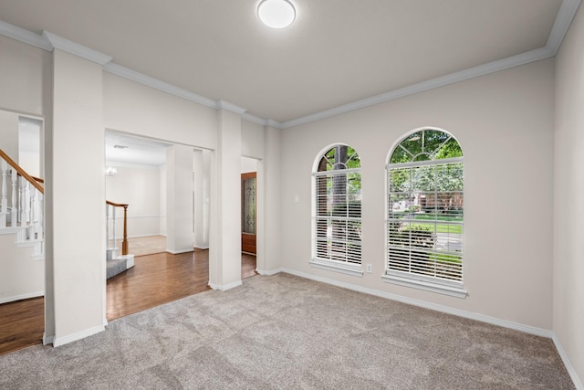 6923 Queensclub Dr, Houston, TX 77069 - empty room featuring carpet flooring, stairs, and ornamental molding