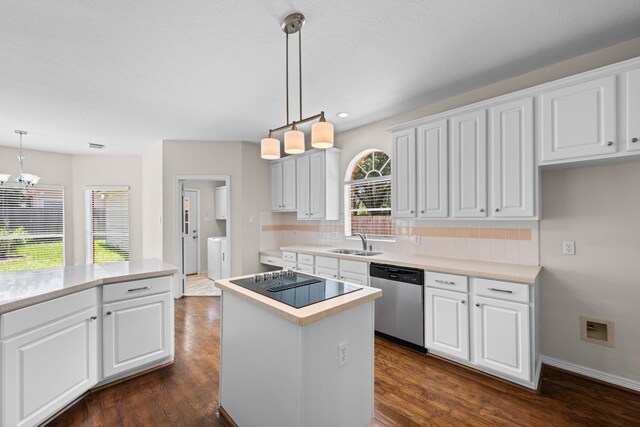 6923 Queensclub Dr, Houston, TX 77069 - kitchen with stainless steel dishwasher, black electric cooktop, separate washer and dryer, decorative backsplash, and recessed lighting
