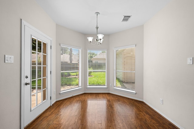 6923 Queensclub Dr, Houston, TX 77069 - unfurnished dining area with wood finished floors and a chandelier