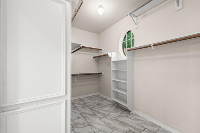 6923 Queensclub Dr, Houston, TX 77069 - spacious closet with light marble finish flooring