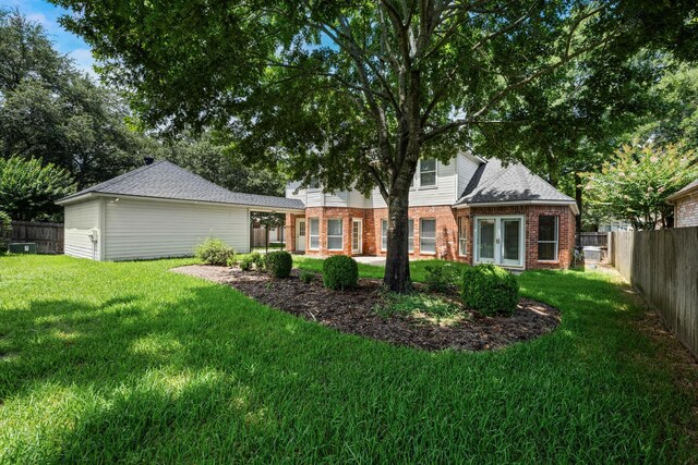 6923 Queensclub Dr, Houston, TX 77069 - rear view of property with brick siding and a fenced backyard