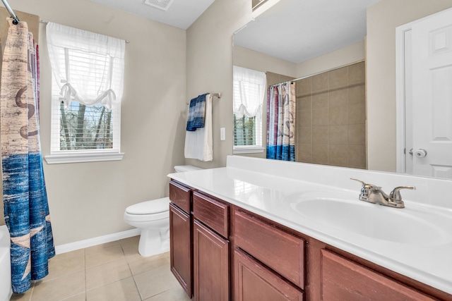 bathroom with tile patterned floors, toilet, a healthy amount of sunlight, and visible vents