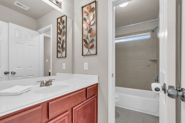 full bathroom with vanity, visible vents, shower / bathing tub combination, tile patterned floors, and toilet