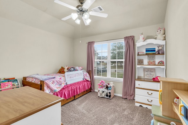 bedroom featuring a ceiling fan, visible vents, carpet floors, baseboards, and vaulted ceiling