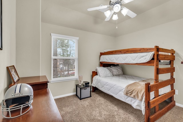 carpeted bedroom featuring baseboards and ceiling fan