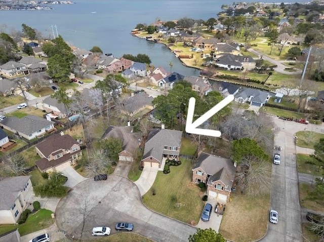 birds eye view of property with a residential view and a water view