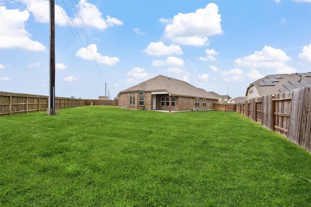 view of yard featuring a fenced backyard