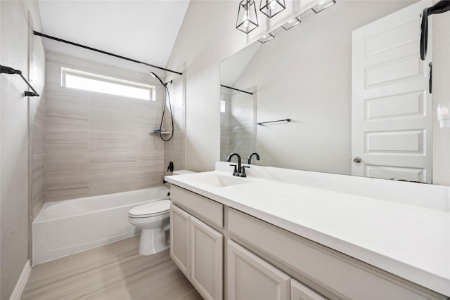 bathroom featuring toilet, bathtub / shower combination, vaulted ceiling, and vanity