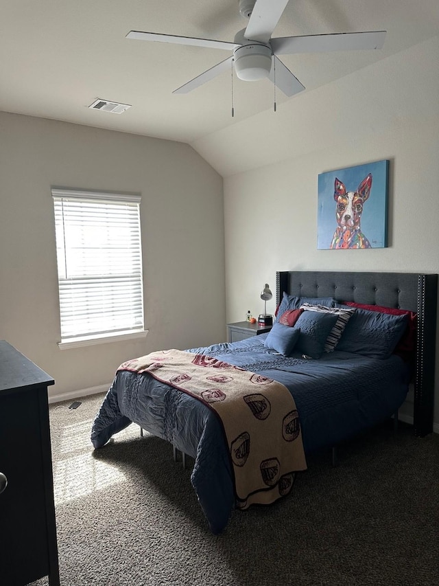 carpeted bedroom featuring ceiling fan, visible vents, vaulted ceiling, and baseboards