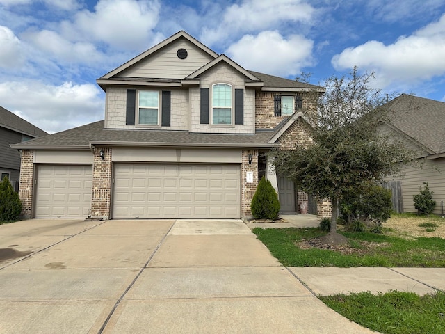 view of front facade with driveway, brick siding, an attached garage, and a shingled roof