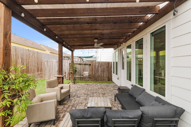 view of patio featuring ceiling fan, a fenced backyard, an outdoor living space, and a pergola