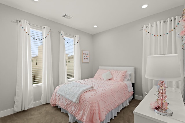 carpeted bedroom with recessed lighting, visible vents, and baseboards