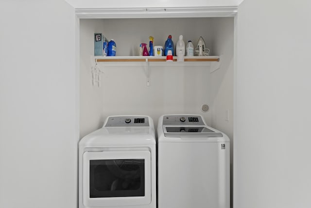 laundry area with laundry area and separate washer and dryer