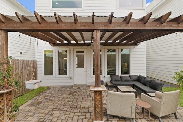 view of patio featuring fence, an outdoor living space, and a pergola