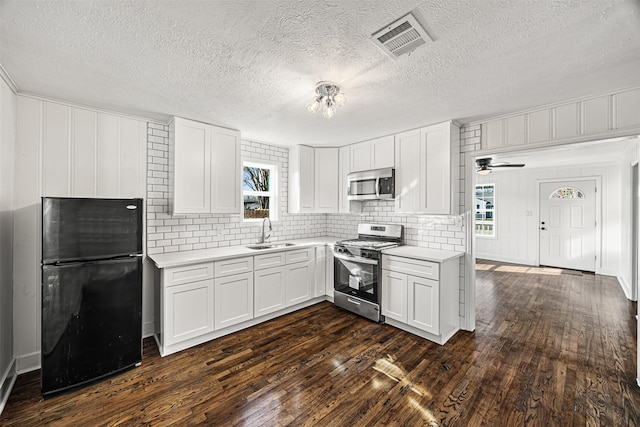 kitchen with plenty of natural light, visible vents, appliances with stainless steel finishes, and a sink