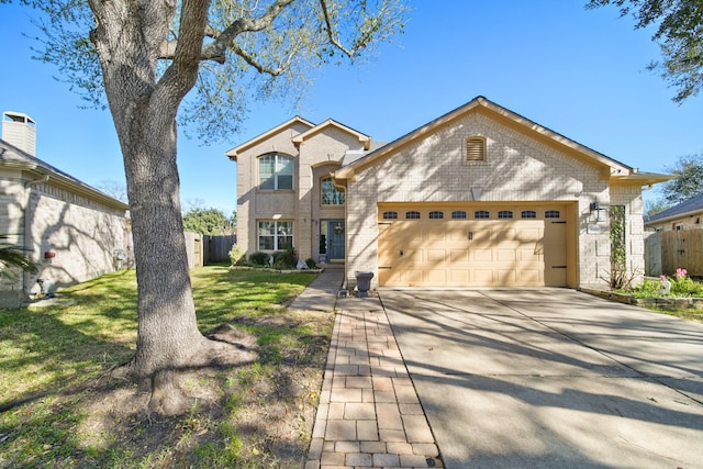 view of front facade featuring an attached garage, brick siding, fence, concrete driveway, and a front yard