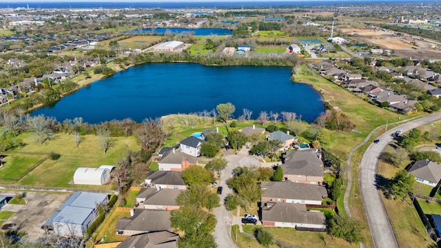 birds eye view of property with a water view and a residential view