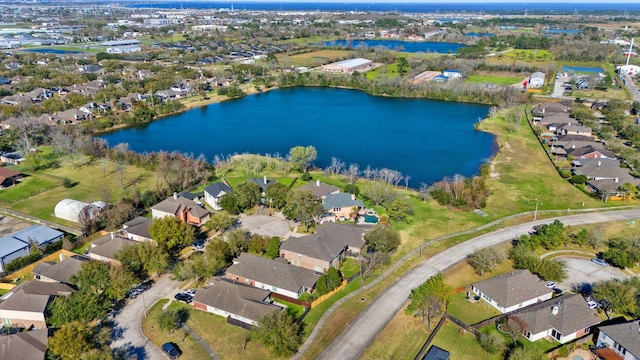 birds eye view of property featuring a water view and a residential view