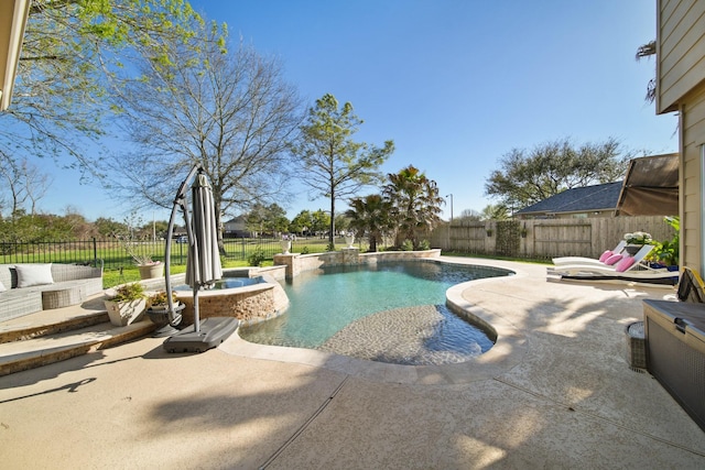 view of swimming pool with a patio area, a fenced backyard, and a fenced in pool