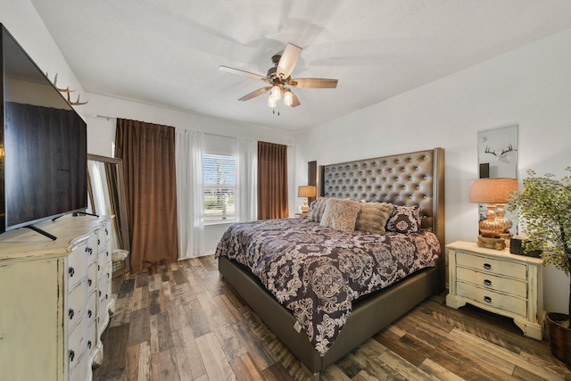 bedroom with wood finished floors and a ceiling fan