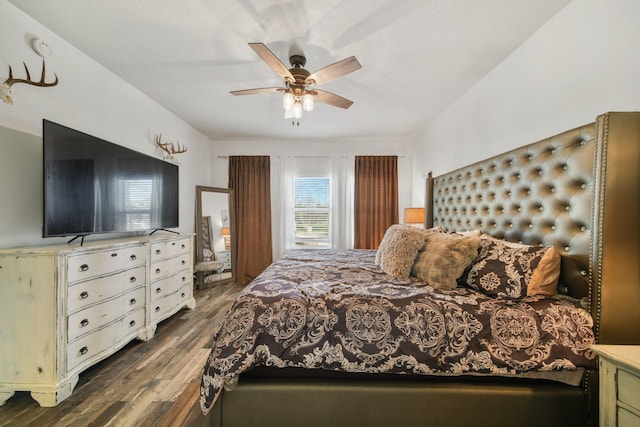 bedroom featuring dark wood finished floors and a ceiling fan