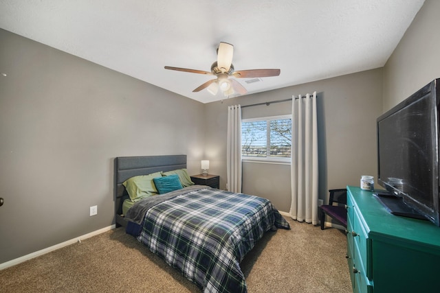 bedroom featuring visible vents, carpet flooring, a ceiling fan, and baseboards