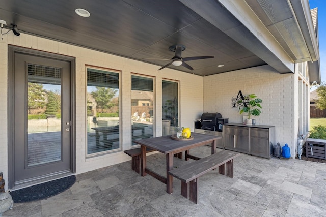 view of patio / terrace with area for grilling and a ceiling fan