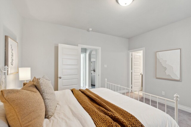 bedroom with carpet floors and baseboards