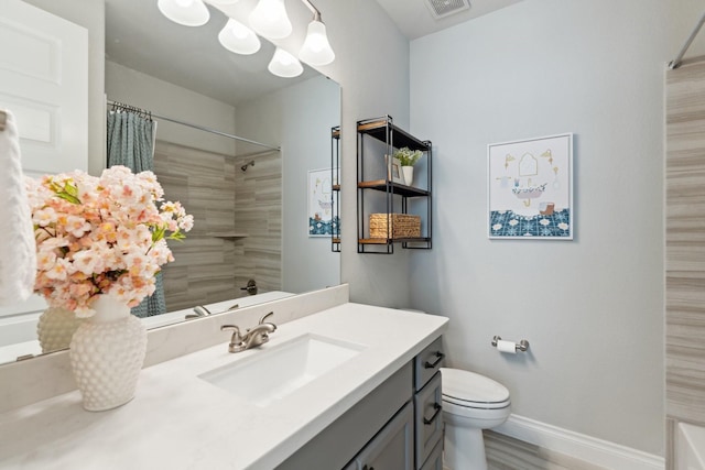 bathroom with visible vents, baseboards, toilet, vanity, and a notable chandelier