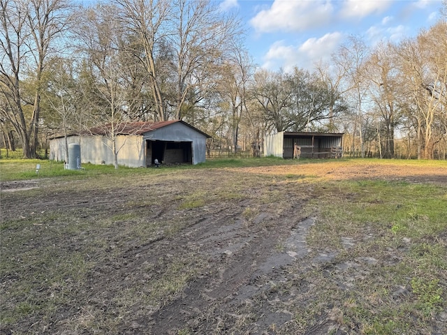 view of yard featuring an outbuilding and a pole building