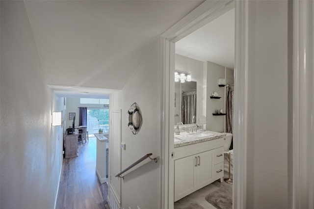 full bath with wood finished floors and vanity