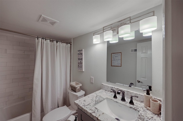 full bath with visible vents, vanity, toilet, and shower / bath combo with shower curtain