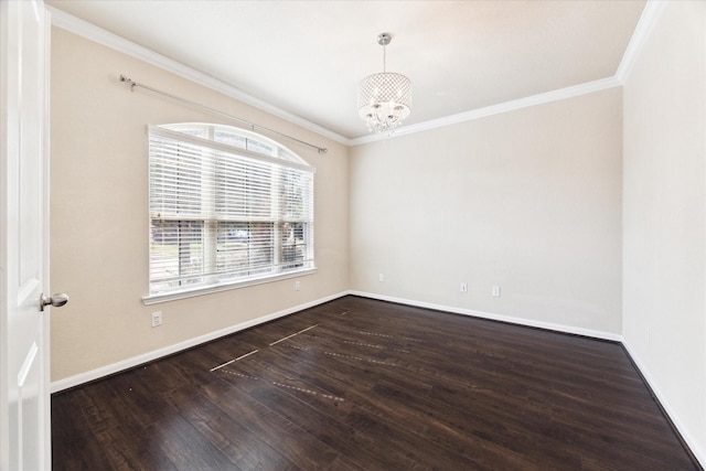 spare room with crown molding, baseboards, wood finished floors, and a notable chandelier