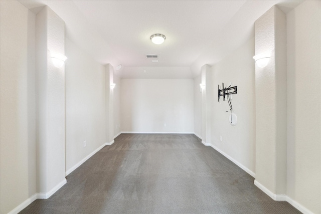 interior space featuring carpet flooring and baseboards