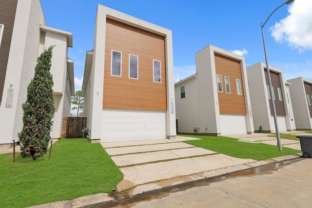 contemporary home featuring a front yard