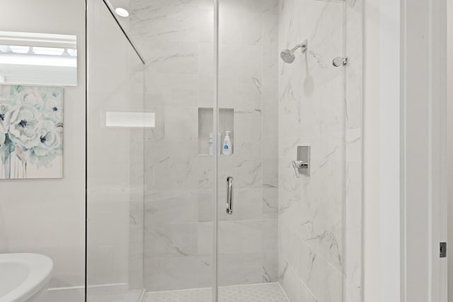 full bath featuring a shower stall