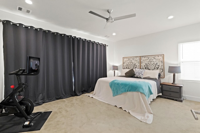 carpeted bedroom with ceiling fan, visible vents, baseboards, and recessed lighting