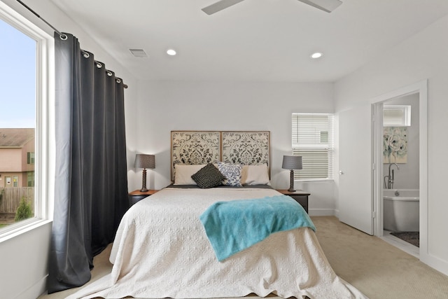 bedroom with light carpet, multiple windows, visible vents, and recessed lighting