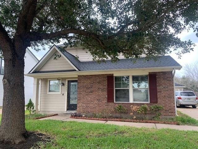 view of front of house featuring brick siding