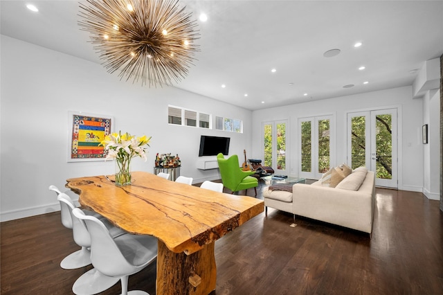 interior space with a chandelier, baseboards, wood finished floors, and recessed lighting